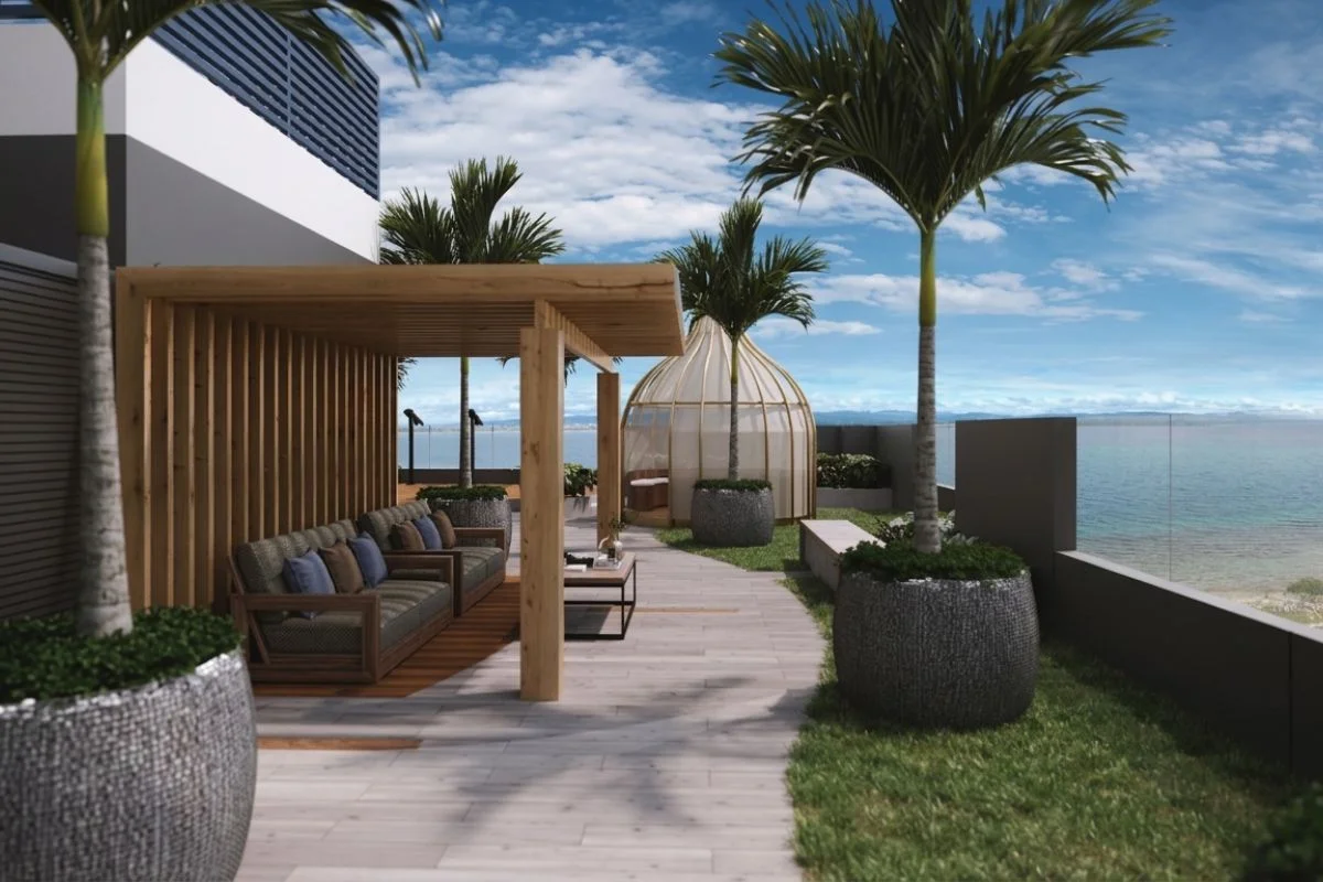 Luxury beachfront condominium skydeck and outdoor lounge amenity with ocean view