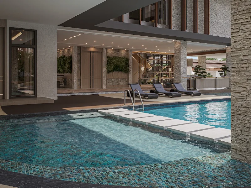 Luxury condominium swimming pool amenity with lounge area and modern architecture
